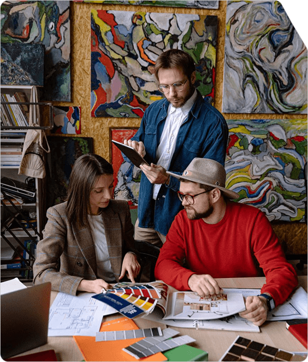 Creative team reviewing campaign artwork and colour swatches